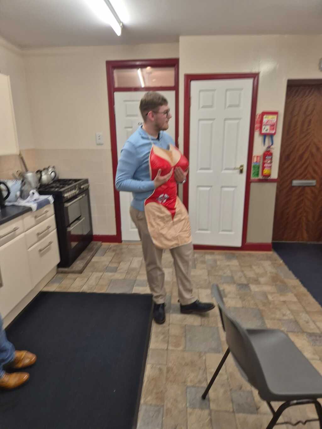 A volunteer helping in the Lodge kitchen