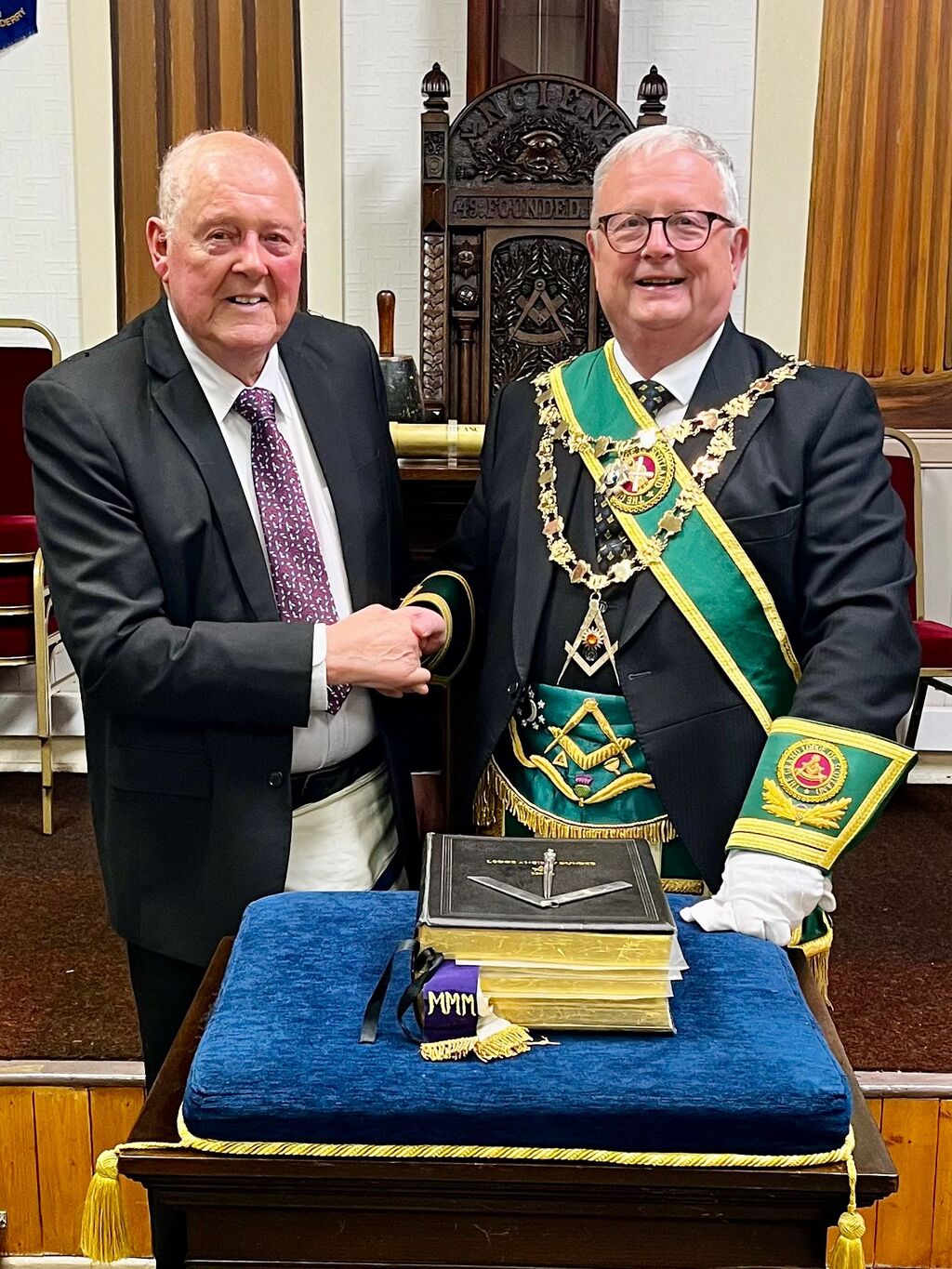 A presentation between visiting Freemasons in the Lodge room